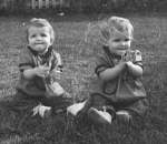 Baby pic of Monica and Monette clapping to music